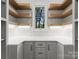 Well-organized pantry with open shelving, ample counter space, and natural light from the window at 20000 Schooner Dr, Cornelius, NC 28031