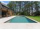A sparkling pool is surrounded by manicured landscaping and a covered area at 20000 Schooner Dr, Cornelius, NC 28031