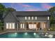 An amazing covered outdoor area includes a fireplace and a view of the pool at 20000 Schooner Dr, Cornelius, NC 28031