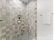 This bathroom features a glass-enclosed shower with beautiful tile and built-in shelving at 20000 Schooner Dr, Cornelius, NC 28031
