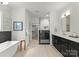 Luxurious bathroom featuring a soaking tub, walk-in shower, and elegant fixtures at 2033 Camp Greene St, Charlotte, NC 28208