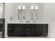 Elegant bathroom with dual vanities, quartz countertops, and modern lighting at 2033 Camp Greene St, Charlotte, NC 28208