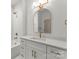 Elegant bathroom featuring white subway tile, gold fixtures, and a stylish vanity at 2033 Camp Greene St, Charlotte, NC 28208