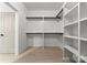 Walk-in closet features custom shelving and ample storage space at 2033 Camp Greene St, Charlotte, NC 28208
