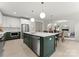Gourmet kitchen featuring custom cabinets, quartz countertops, stainless steel appliances, and open layout at 2033 Camp Greene St, Charlotte, NC 28208