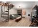 Basement living area featuring spiral staircase, brick fireplace, and neutral toned decor at 2298 Wintercrest Dr, Rock Hill, SC 29732