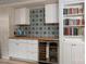 Basement featuring a built in bar, wine fridge, ample storage, and contemporary decor at 2298 Wintercrest Dr, Rock Hill, SC 29732