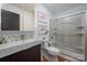 Bathroom showcasing modern vanity, mosaic tile accent wall, and walk in shower with glass door at 2298 Wintercrest Dr, Rock Hill, SC 29732