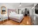 Bedroom with a plush bed, hardwood floors, updated lighting, and closet at 2298 Wintercrest Dr, Rock Hill, SC 29732