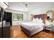 Bedroom featuring a plush bed, hardwood floors, neutral color palette, and updated lighting at 2298 Wintercrest Dr, Rock Hill, SC 29732