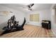 This bedroom featuring minimalist decor, ceiling fan, and light woodgrain laminate flooring at 2298 Wintercrest Dr, Rock Hill, SC 29732