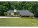 Charming home with a well-manicured lawn, lush landscaping, and a classic exterior, perfect for curb appeal at 2298 Wintercrest Dr, Rock Hill, SC 29732