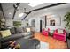 Spacious living room with hardwood floors, skylights, and modern furnishings at 2298 Wintercrest Dr, Rock Hill, SC 29732