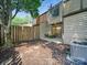 View of the backyard with a privacy fence and a small patio area perfect for outdoor seating at 2324 Brookview Ct, Rock Hill, SC 29732