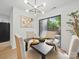 Dining room featuring contemporary lighting, a dark table set for four, and sliding glass doors to the yard at 2324 Brookview Ct, Rock Hill, SC 29732