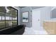 Contemporary bathroom with a freestanding black bathtub, marble floors, and a large window with nature views at 2413 Cross Country Rd, Charlotte, NC 28270