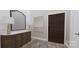 Inviting entryway featuring a wooden console table, stylish mirror, lamps, and a patterned rug at 2413 Cross Country Rd, Charlotte, NC 28270