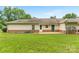 Home exterior featuring a well-maintained yard with a cozy patio at 2561 26Th Ne Ave, Hickory, NC 28601
