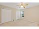 Bright bedroom with a ceiling fan, neutral walls, and a large closet at 2561 26Th Ne Ave, Hickory, NC 28601