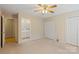 Spacious bedroom with a view of an adjoining bathroom and features neutral carpeting at 2561 26Th Ne Ave, Hickory, NC 28601
