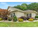 Well-maintained home with manicured landscaping and mature trees at 2561 26Th Ne Ave, Hickory, NC 28601