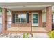 Inviting front porch with brick accents and white trim at 2561 26Th Ne Ave, Hickory, NC 28601