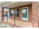 Inviting front porch with brick accents and charming details at 2561 26Th Ne Ave, Hickory, NC 28601