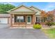 Charming brick home with a welcoming front porch and beautifully landscaped yard at 2561 26Th Ne Ave, Hickory, NC 28601