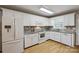 Updated kitchen featuring white cabinets, granite countertops, and a large window for natural light at 2561 26Th Ne Ave, Hickory, NC 28601