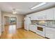 Bright kitchen featuring white cabinets, granite countertops, and stainless steel appliances at 2561 26Th Ne Ave, Hickory, NC 28601