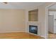 Cozy living room featuring a fireplace with tile surround and built-in shelving, perfect for relaxing at 2561 26Th Ne Ave, Hickory, NC 28601