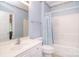 Bathroom with white vanity, toilet and blue shower curtain at 3814 Misty Glen Ct, Matthews, NC 28105