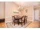 Elegant dining room featuring a chandelier, a dining table, and an area rug at 3814 Misty Glen Ct, Matthews, NC 28105