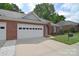 Charming brick home featuring a two-car garage and a well-manicured lawn at 3814 Misty Glen Ct, Matthews, NC 28105