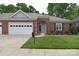Charming brick home featuring a two-car garage and a well-manicured lawn at 3814 Misty Glen Ct, Matthews, NC 28105