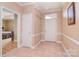 Inviting foyer with neutral tile flooring and white trim, leading to other rooms at 3814 Misty Glen Ct, Matthews, NC 28105