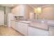 Bright kitchen features white cabinets, appliances, and a convenient breakfast bar area at 3814 Misty Glen Ct, Matthews, NC 28105