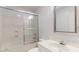 Clean bathroom with a shower-tub, sliding glass doors, a decorative mirror, and sleek fixtures at 401 Lake Club Dr, Rock Hill, SC 29732