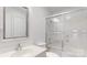Bright bathroom featuring a shower-tub combination with sliding glass doors and a decorative mirror at 401 Lake Club Dr, Rock Hill, SC 29732