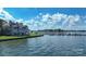 Picturesque condo building by the water, featuring a boat dock, lush landscaping, and serene waterfront views at 401 Lake Club Dr, Rock Hill, SC 29732