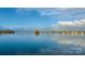 Scenic lake view featuring a small island and calm waters under a partly cloudy blue sky at 401 Lake Club Dr, Rock Hill, SC 29732