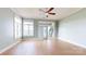 Spacious living room featuring hardwood floors, a ceiling fan, and lots of natural light at 401 Lake Club Dr, Rock Hill, SC 29732