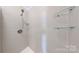 Modern shower with sleek tile and glass shelves, creating a spa-like experience at 401 Lake Club Dr, Rock Hill, SC 29732