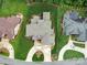 An aerial view showcases the home's layout, manicured lawn, and surrounding landscape at 4025 Foxes Trl, Cramerton, NC 28032