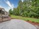 Lush backyard with a built-in grill and an expansive lawn, ideal for outdoor gatherings at 4025 Foxes Trl, Cramerton, NC 28032