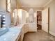 Spacious bathroom features marble countertops, dual sinks, vanity with mirrors, and tile flooring at 4025 Foxes Trl, Cramerton, NC 28032