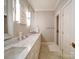 Bright bathroom with double vanity sinks, a large mirror, and a glass-enclosed shower at 4025 Foxes Trl, Cramerton, NC 28032