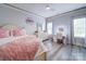 Bright bedroom with a ceiling fan, vanity and a neutral color palette offering a calming and stylish atmosphere at 4025 Foxes Trl, Cramerton, NC 28032