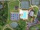 Aerial view of community amenities including pool, tennis courts, playground and parking at 4025 Foxes Trl, Cramerton, NC 28032