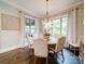 Dining room with natural light, a round table, upholstered chairs, and decorative lighting fixtures at 4025 Foxes Trl, Cramerton, NC 28032